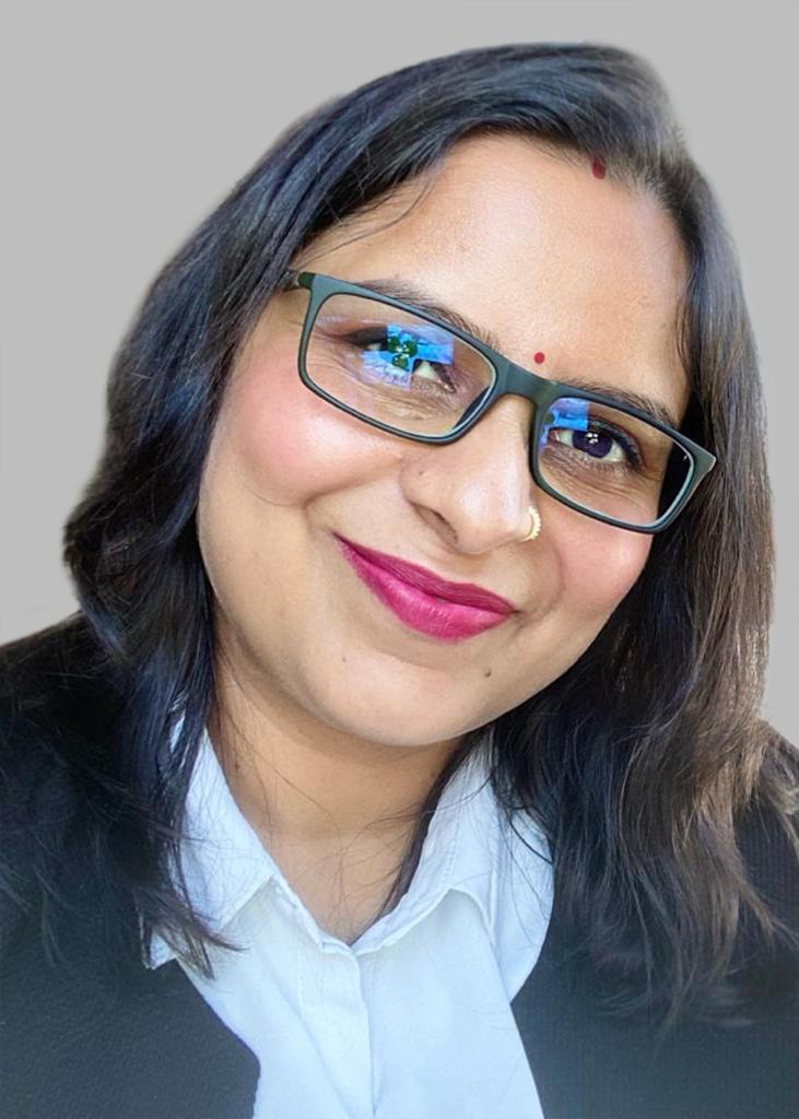 Anuradha Mishra, Director and Co-founder of Visioncraft Consultants, smiling in a professional portrait