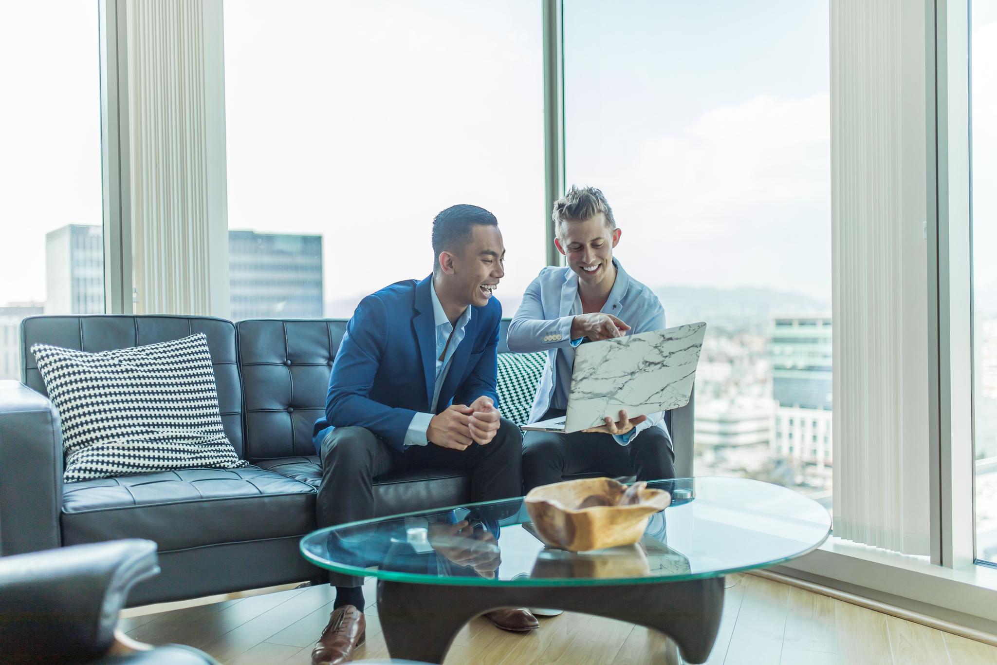 Two Business Professionals Sharing Insights Over a Laptop