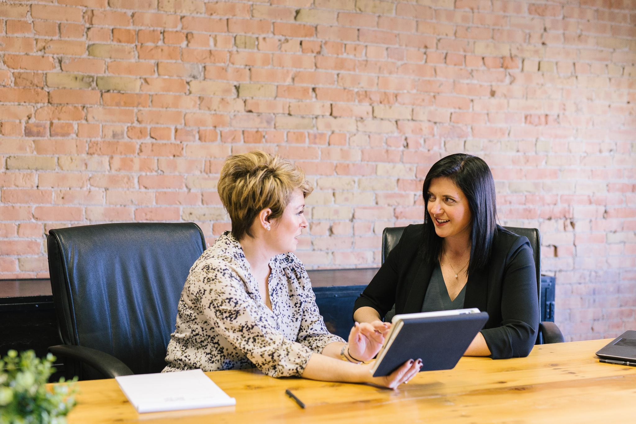 Two Women Collaborating in a Professional Setting