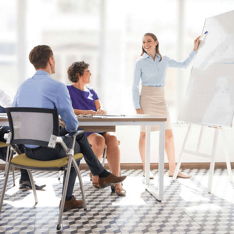 Team Leader Presenting Strategy to Colleagues in a Modern Office